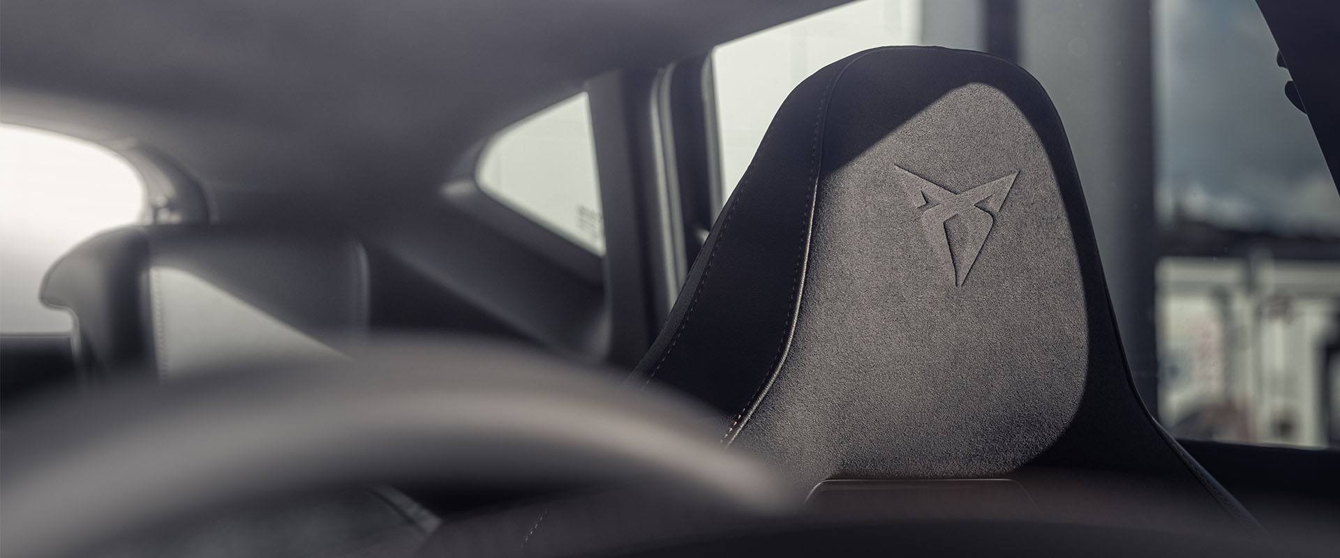 Side profile of a CUPRA Formentor with black alloy wheels and exclusive upgrades