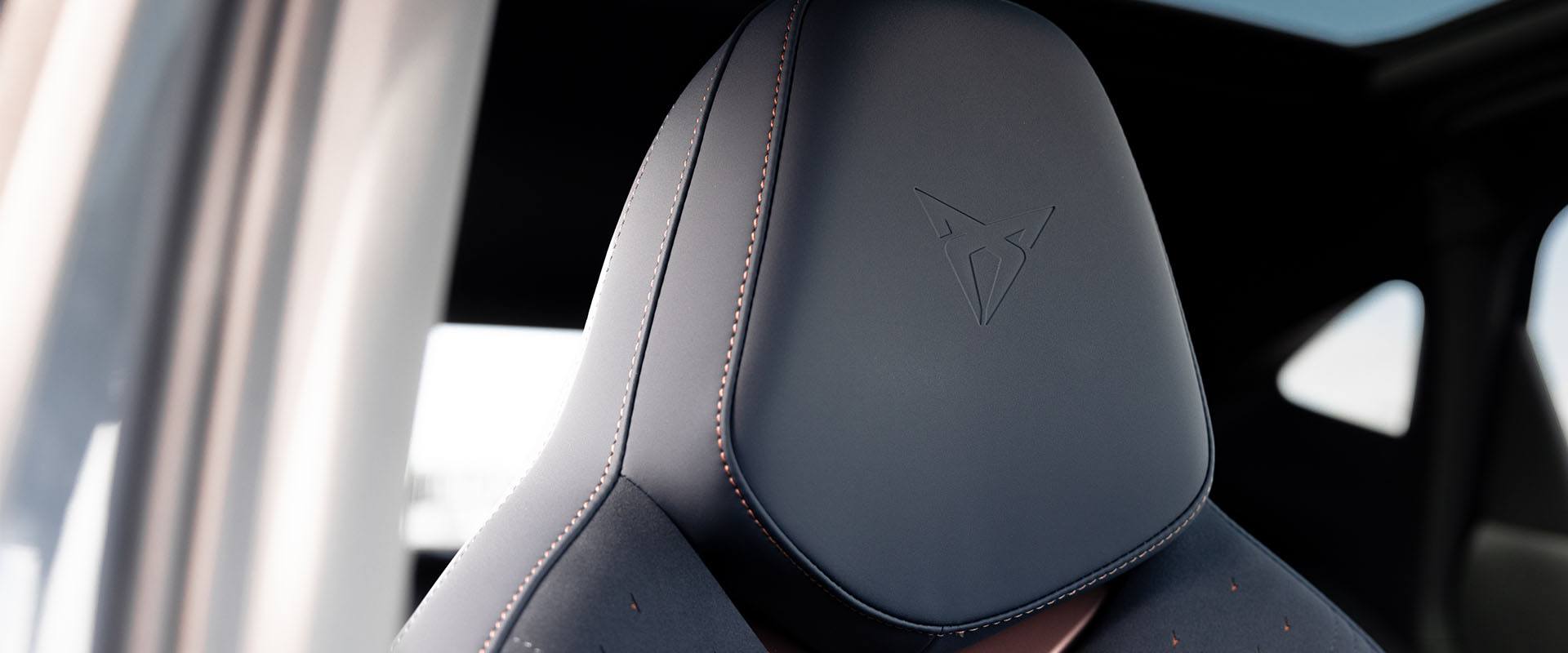 Side profile of a CUPRA Formentor with black alloy wheels and exclusive upgrades