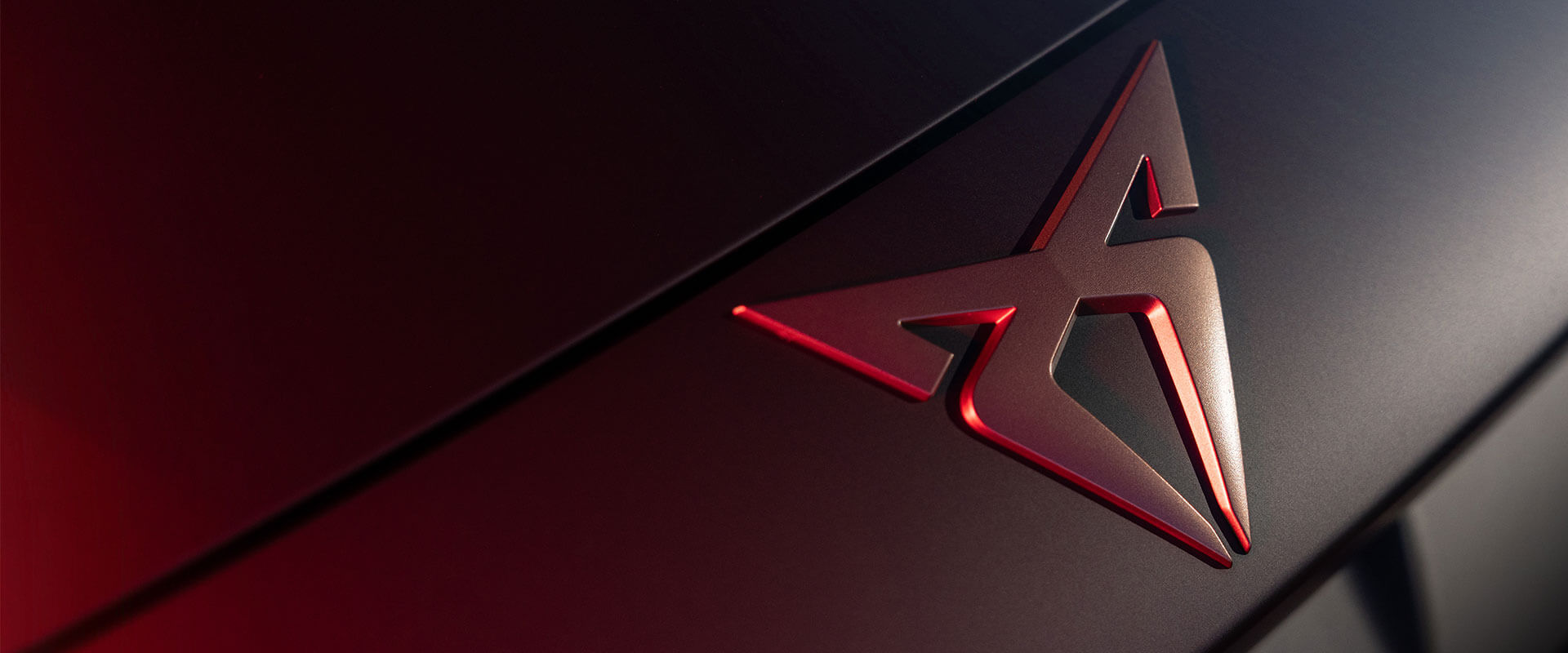 Close up photo of a Cupra car badge