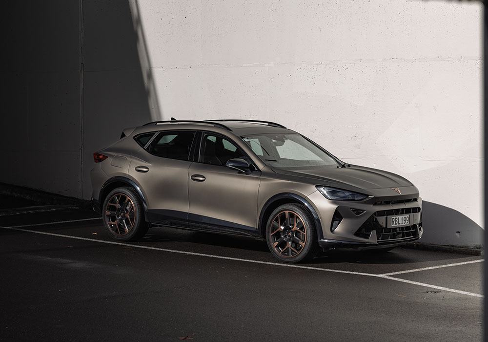 Front and side view of a bronze colour sports suv