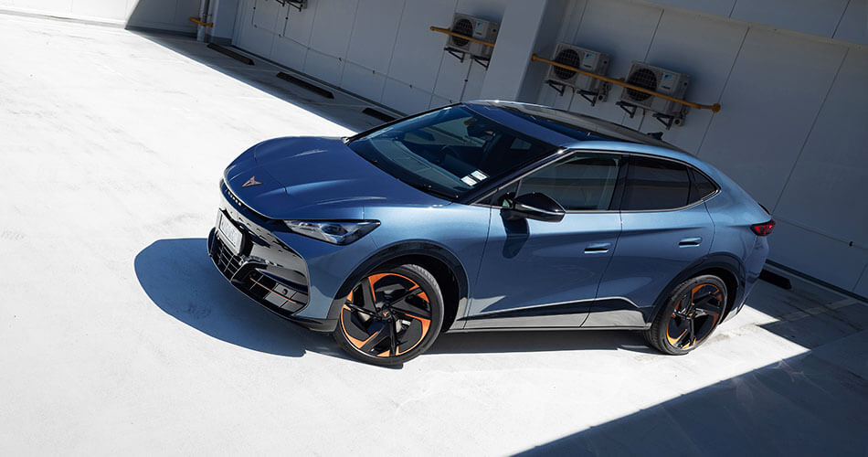 High angled photo of a blue CUPRA Tavascan sports SUV