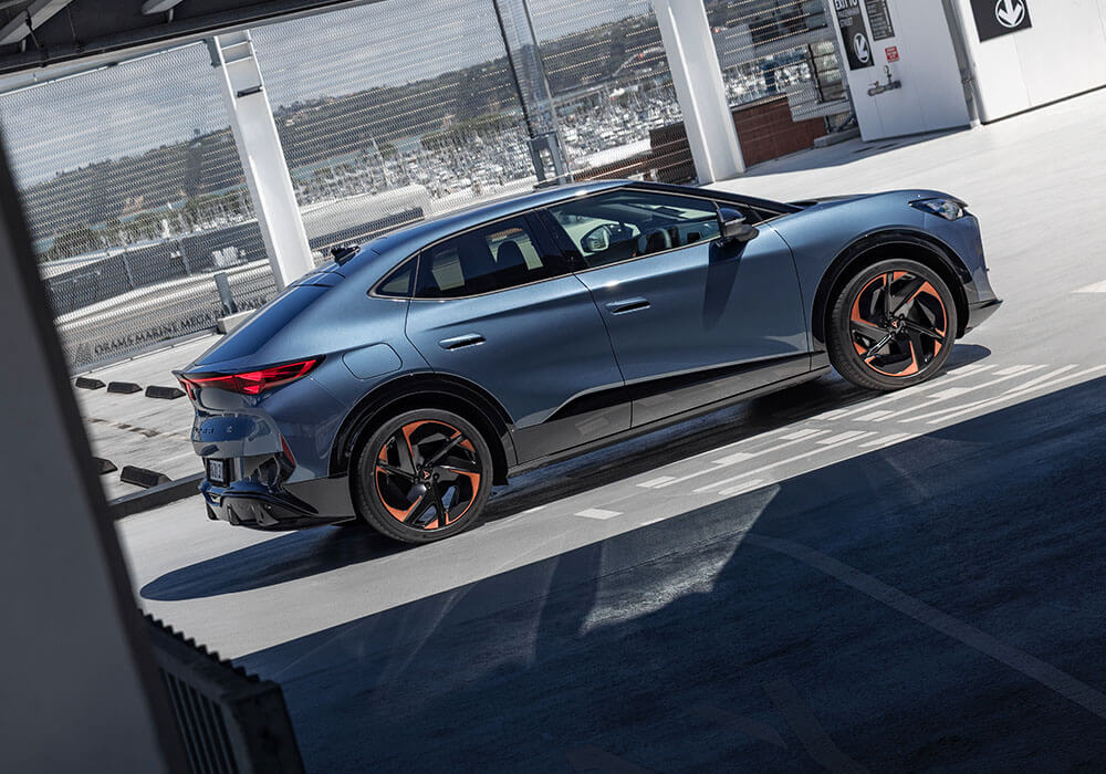 Angled photo of the side of a CUPRA sports car in blue