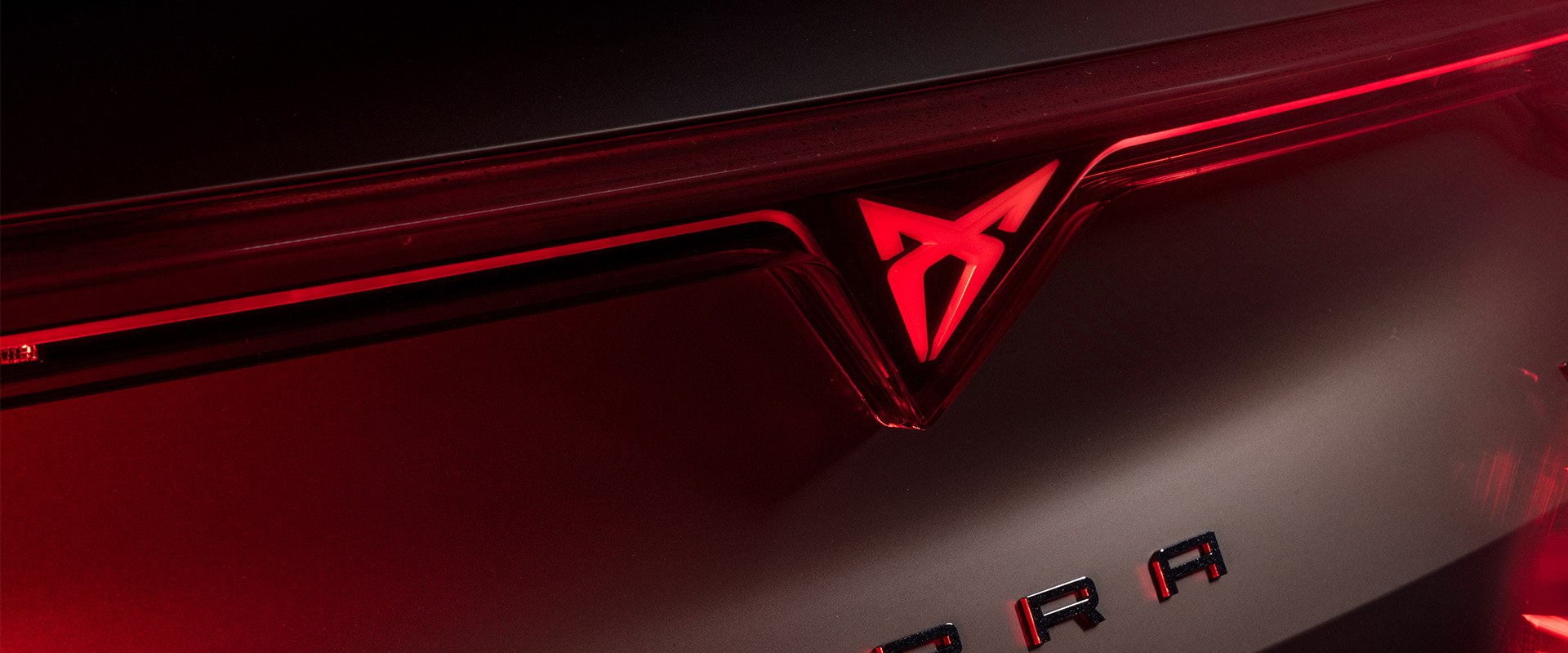 Close up photo of a Cupra car badge